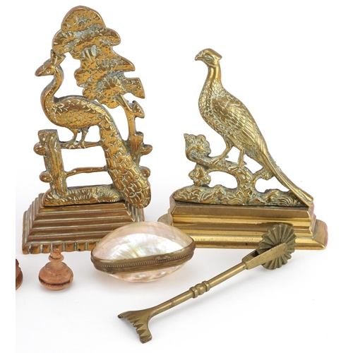 1335 - A small group of collector's items including a mother-of-pearl and brass box, a treen model of a sit... 