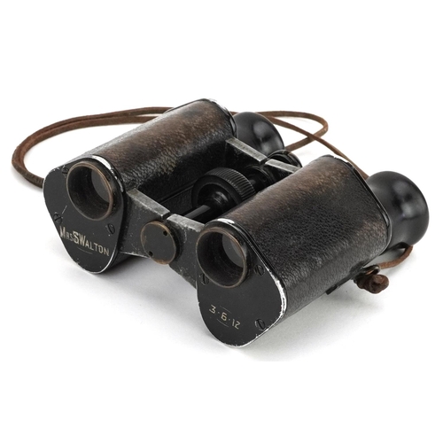 712 - A pair of Russian military interest World War I binoculars with leather case.