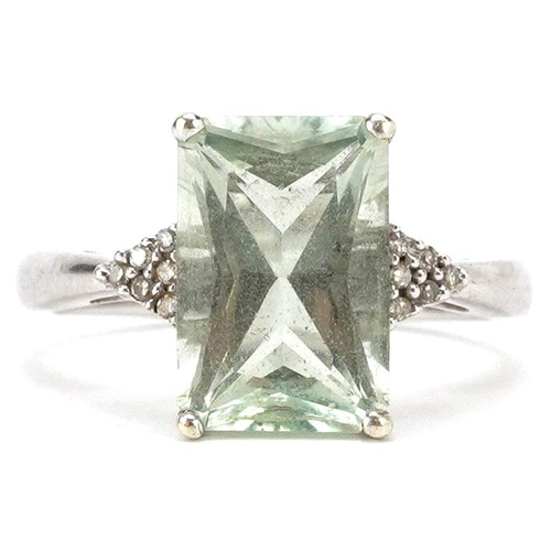 2011 - A 9ct white gold pale green stone ring with diamond set shoulders, size P, 3.4g.