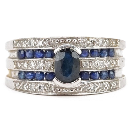 A 9ct white gold diamond and sapphire four row dress ring, size Q, 4.4g.