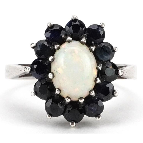 2145 - A silver cabochon opal and blue spinel cluster flower head ring, size L, 2.7g.