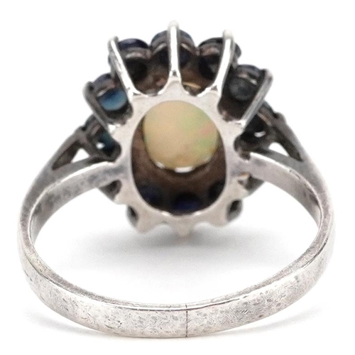 2145 - A silver cabochon opal and blue spinel cluster flower head ring, size L, 2.7g.