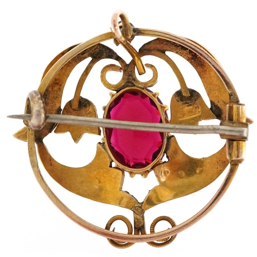 2006 - An Art Nouveau 9ct gold seed pearl openwork floral brooch set with a red and pink stone, 2.6cm in di... 