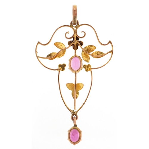 2063 - An Art Nouveau unmarked gold openwork pendant set with pink stones, 4cm high, 1.9g.