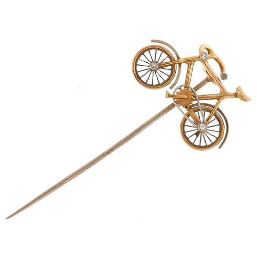 2068 - An antique unmarked gold and platinum stickpin in the form of a bicycle set with diamonds, having ro... 