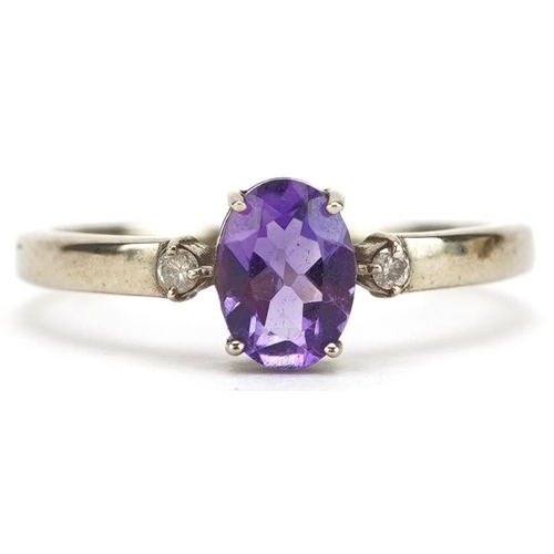 2367 - A 9ct gold amethyst solitaire ring with diamond set shoulders, size N/O, 1.5g.