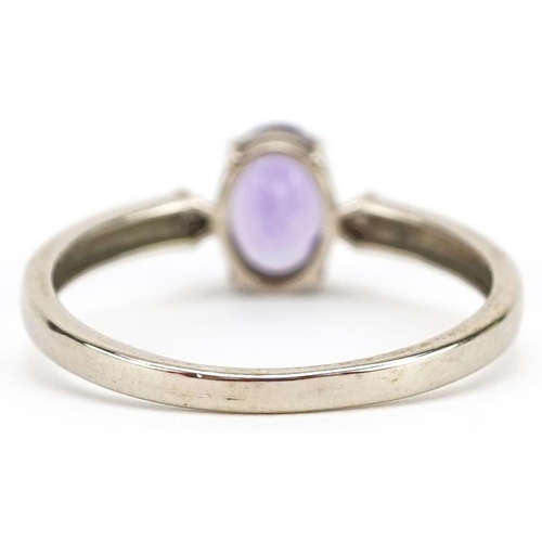 2367 - A 9ct gold amethyst solitaire ring with diamond set shoulders, size N/O, 1.5g.