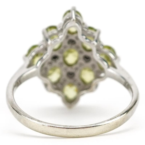 2014 - A 9ct white gold green iolite and diamond ring, size J/K, 2.5g.