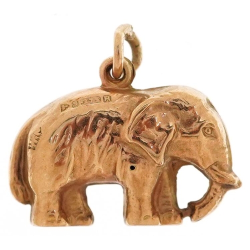 2196 - A 9ct gold charm in the form of an elephant, 1.6cm wide, 0.8g.