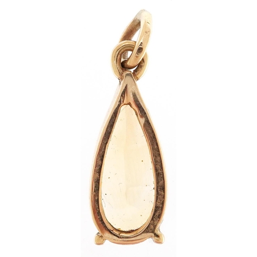 2347 - A citrine teardrop pendant with yellow metal mount, 28mm high, 3.7g.