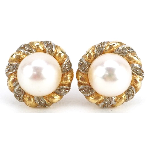 2331 - A pair of unmarked gold cultured pearl and diamond stud earrings, the pearl 7.5mm in diameter, overa... 