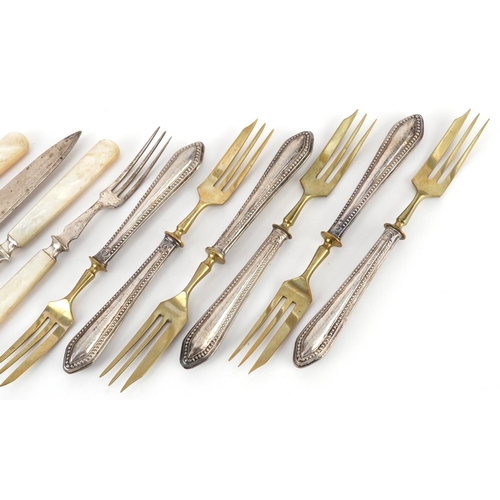 361 - A pair of Mappin & Webb silver and mother of pearl knives and forks together with a set of six silve... 