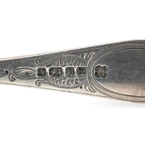 195 - Martin, Hall & Co., a Victorian silver caddy spoon with engraved decoration, Sheffield 1875, 11.5cm ... 