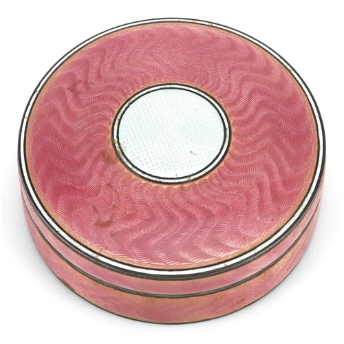 39 - A continental silver and pink guilloche enamelled circular box and cover, London import marks, 7cm i... 