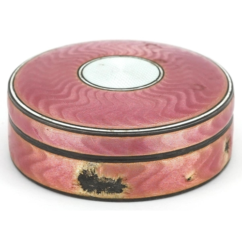 39 - A continental silver and pink guilloche enamelled circular box and cover, London import marks, 7cm i... 