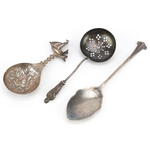 200 - Three silver spoons including an apostle sifting spoon and a Danish caddy spoon embossed with figure... 