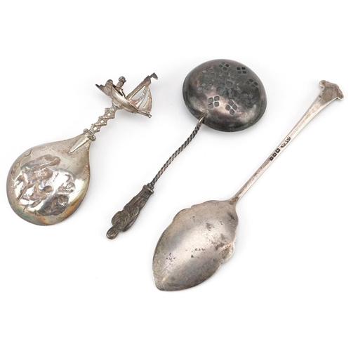 200 - Three silver spoons including an apostle sifting spoon and a Danish caddy spoon embossed with figure... 