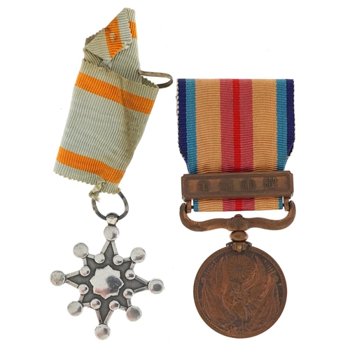 737 - A Japanese military World War II Sacred Eighth Class medal and a Japanese 1937 Incident War medal wi... 