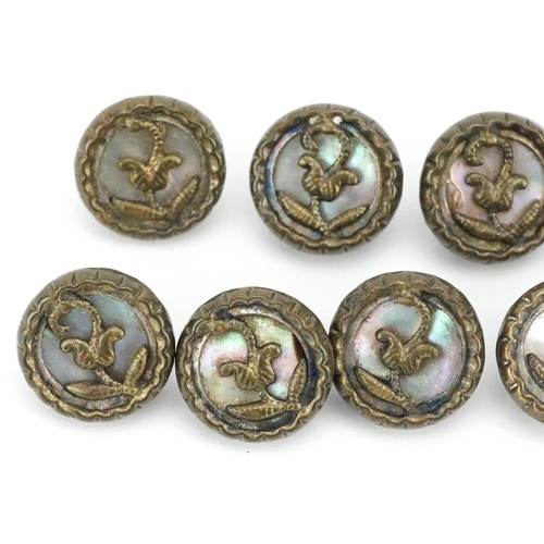 213 - A set of eleven vintage gilt metal and mother of pearl buttons, 10mm in diameter.