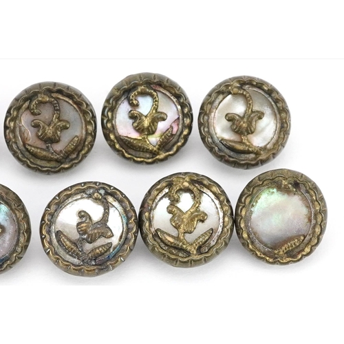 213 - A set of eleven vintage gilt metal and mother of pearl buttons, 10mm in diameter.