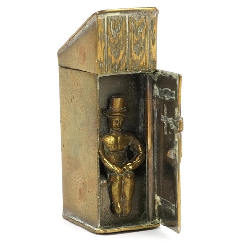 A vintage novelty brass vesta in the form of a gentleman in an outhouse, 5cm high.