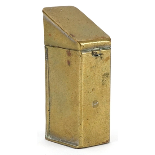 299 - A vintage novelty brass vesta in the form of a gentleman in an outhouse, 5cm high.