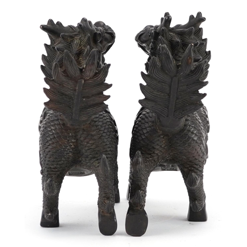 350 - A pair of Chinese patinated bronze figures in the form of a horse with a dragon heads, character mar... 