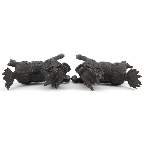 350 - A pair of Chinese patinated bronze figures in the form of a horse with a dragon heads, character mar... 