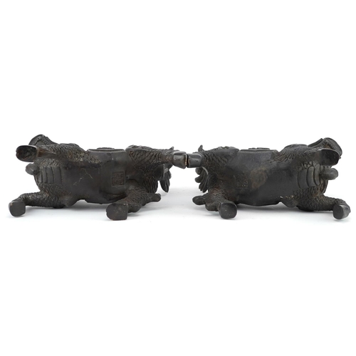 350 - A pair of Chinese patinated bronze figures in the form of a horse with a dragon heads, character mar... 