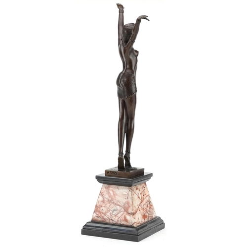 340 - An Art Deco style patinated bronze figure of a female dancer raised on a marble column, 55.5cm high.