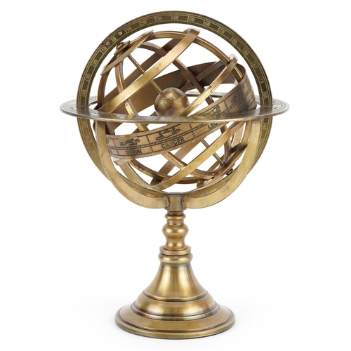 1365 - A gilt metal zodiac desk globe, 26.5cm high.