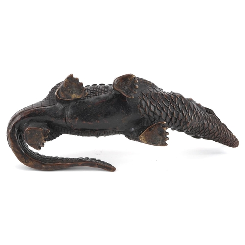 377 - A patinated bronze study of a crocodile, 23.5cm in length.