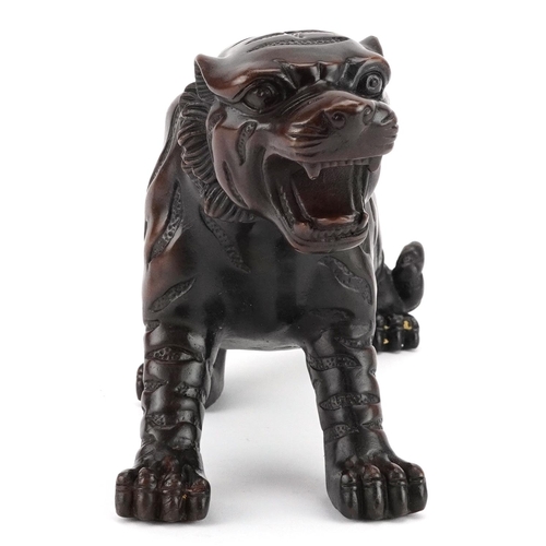 351 - A Japanese patinated bronze okimono figure of a tiger, 33cm in length.