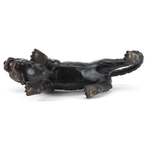 351 - A Japanese patinated bronze okimono figure of a tiger, 33cm in length.