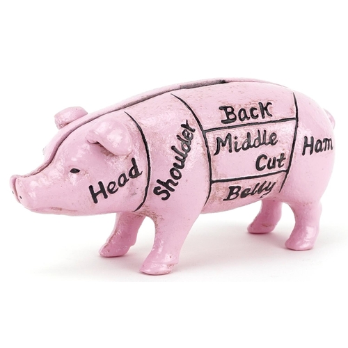 1303 - A cast iron model of a pink piggy bank, 19.5cm in length.