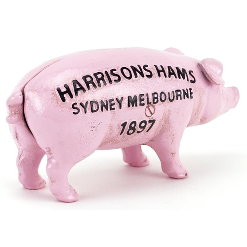 1303 - A cast iron model of a pink piggy bank, 19.5cm in length.