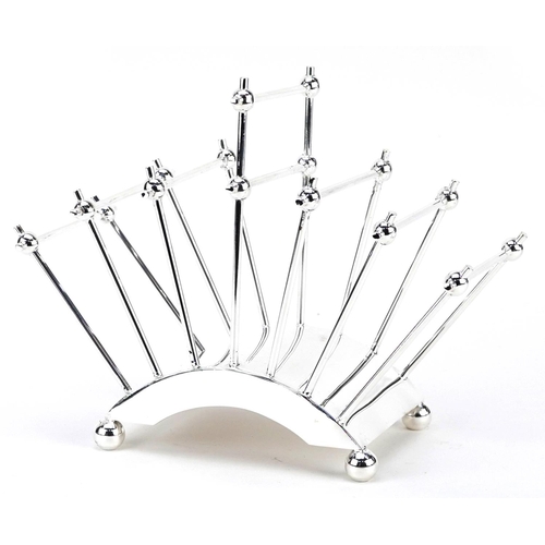 1319 - A novelty silver plated toast rack, 22cm in length.