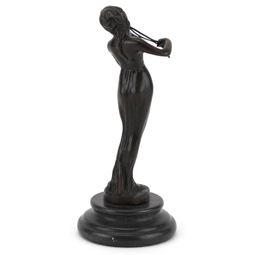 1346 - A patinated bronze study of a female playing the violin, raised on a circular black marble base, 19.... 