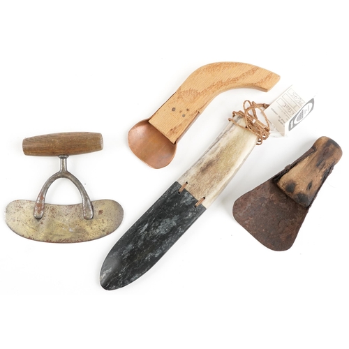 1186 - A group of four Canadian Inuit items from Baffin Island, mid 20th century, to include a copper heade... 