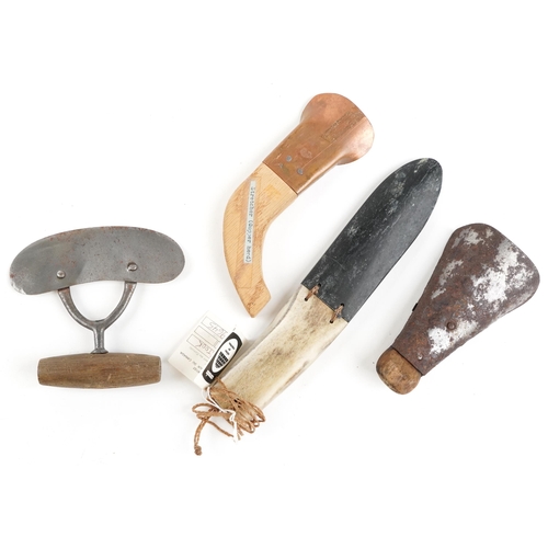 1186 - A group of four Canadian Inuit items from Baffin Island, mid 20th century, to include a copper heade... 