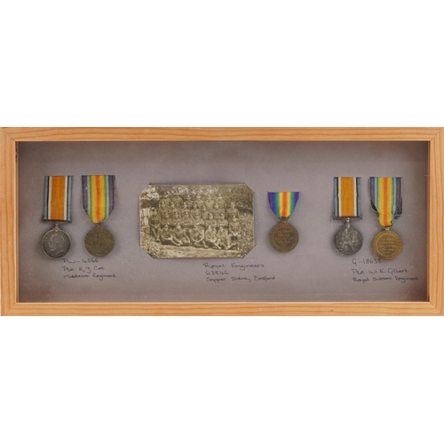 660 - Five British military World War I medals including two pairs awarded to PW.4066 PTE.R.J.COX.MIDD'X R... 