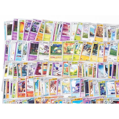 532 - A large collection of 2023 Japanese Pokémon trade cards, some holographic, approximately two hundred... 