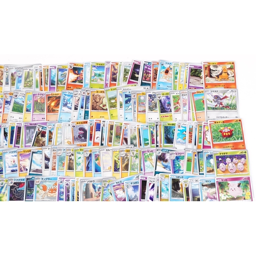 532 - A large collection of 2023 Japanese Pokémon trade cards, some holographic, approximately two hundred... 