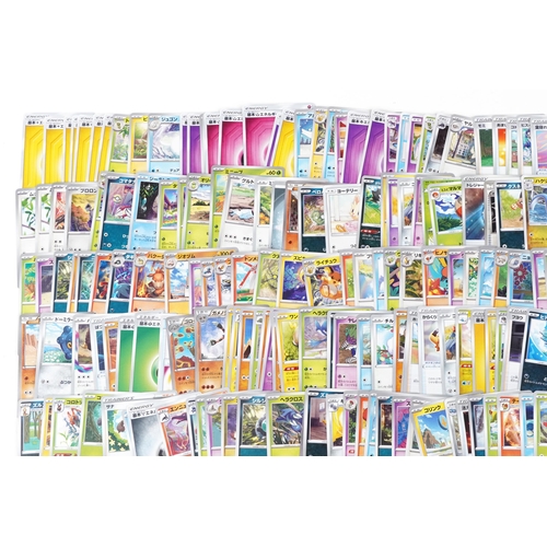 533 - A large collection of 2023 Japanese Pokémon trade cards, some holographic, approximately two hundred... 