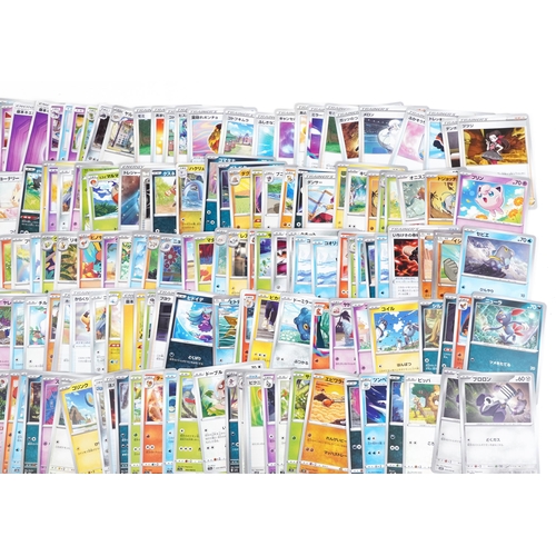 533 - A large collection of 2023 Japanese Pokémon trade cards, some holographic, approximately two hundred... 