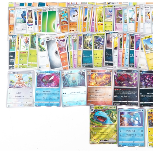 533 - A large collection of 2023 Japanese Pokémon trade cards, some holographic, approximately two hundred... 