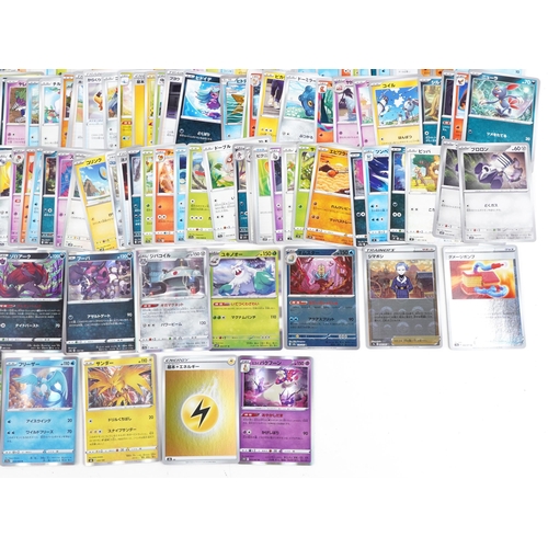 533 - A large collection of 2023 Japanese Pokémon trade cards, some holographic, approximately two hundred... 