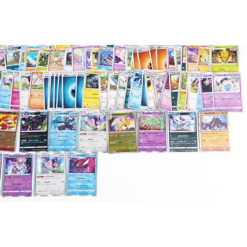 531 - A large collection of 2023 Japanese Pokémon trade cards, some holographic, approximately two hundred... 