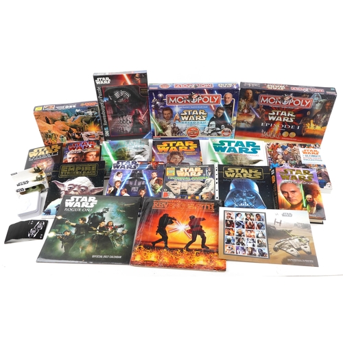 580 - Star Wars memorabilia including a collection of hardback books, calendars, Star Wars Monopoly and St... 