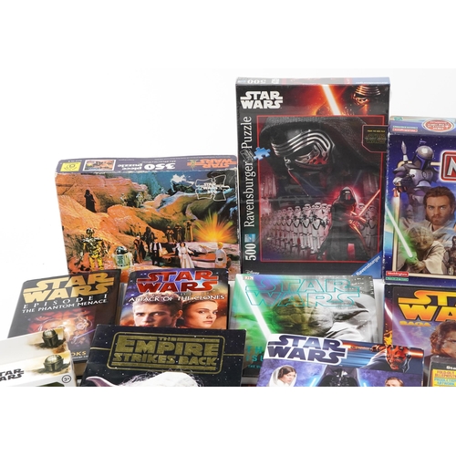 580 - Star Wars memorabilia including a collection of hardback books, calendars, Star Wars Monopoly and St... 